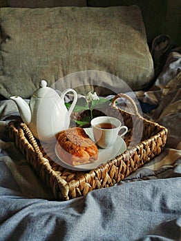 Bed breakfast with bread and a cup of tea