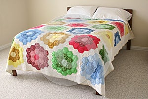 Bed with floral quilt photo