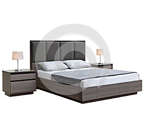 A bed with a grey and black headboard and a white comforter