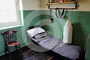 Bed and kit belonging to a WW1 soldier in a restored army barracks room