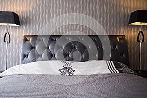 Bed with leather headrest