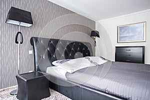 Bed with leather headrest