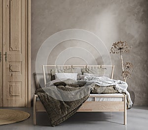 Bed with linen bedding, dry plant and wooden door in bedroom, room in natural tones