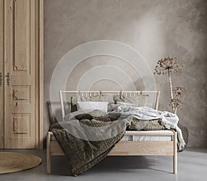 Bed with linen bedding, dry plant and wooden door in bedroom, room in natural tones photo