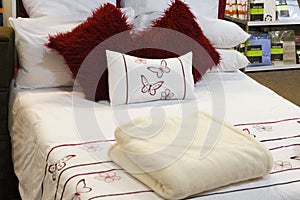 Bed with linen in a house accessory retail store