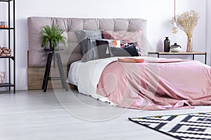 Bed with pink quilt cover