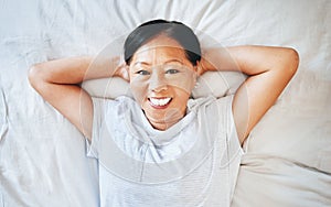 Bed, portrait and happy mature woman sleeping, tired or nap for stress relief, morning wellness or retirement rest. Top