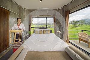 Bed room in hone stay in Nan with rice fields out sid of windows