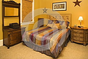 Bed With Striped Bedspread in Affluent Home