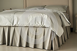 bed with a tailored cashmere bed skirt and highend sheets