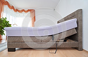 Bed with tilt adjustment mattress bed in the bedroom of the house, comfortable mattress and sleep