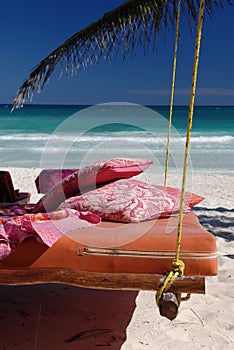 Bed on tropical beach
