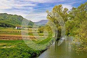 Bednja river and Bela castle springtime view