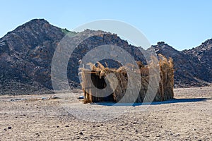 Bedouin building of palm twigs in a desert not far from Hurghada city, Egypt