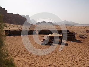 Bedouin camp with tents planted in the sand in Wadi Rum desert, Jordan