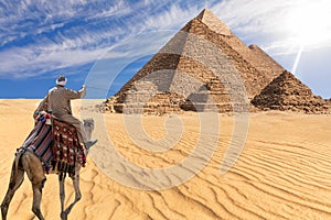 A bedouin of Giza desert in front of the Great Pyramids, Egypt