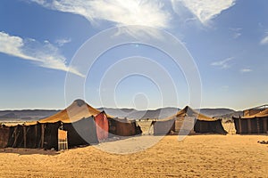 Bedouin tent with clear blue sky above it photo