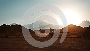 Bedouin village in desert in mountains in sunset