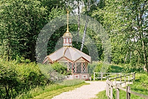 Bedrock with a golden angel on the roof, the holy spring of St. David in the village of Talezh. Moscow region, Russia