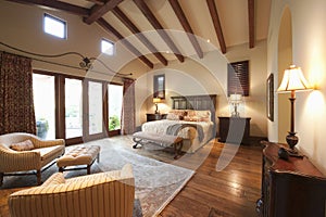Bedroom With Beamed Wooden Ceiling