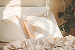 Bedroom with bed and bedding. Warm ivory duvet quilt plaid lying on messy bed in cozy bedroom. Home staging, hotel or