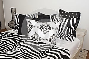 Bedroom with black and white pillows