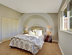 Bedroom with carpet floor and doors to built-in closet