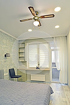 Bedroom with ceiling fan chandelier