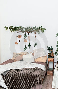 Bedroom with Christmas decoration. Bedroom prepaired for Christmas Eve. New Year decoration