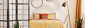 Bedroom design with orange and yellow colors in modern a