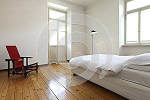 Bedroom with a double bed and chair