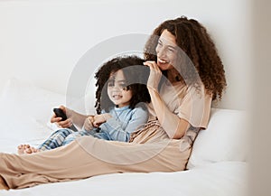 Bedroom, happy family child and mother watching tv series, movie or streaming online video, cinema or entertainment