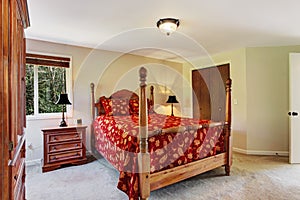 Bedroom with high pole bed and wardrobe