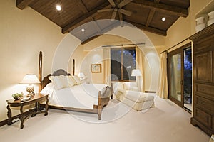 Bedroom With High Wooden Ceiling