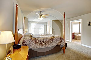 Bedroom interior. Beautiful bed with high posts