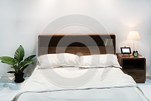 Bedroom interior with bed and pillow of cosy home in modern design. Vintage bedroom.