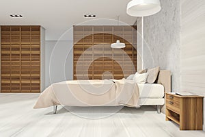 Bedroom interior with bright wood panels and white parquet floor