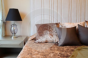 Bedroom interior design with tweed brown pillows
