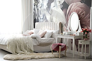 Bedroom interior with elegant dressing table and floral wallpaper