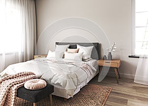 Bedroom interior mockup in boho style with wooden floor and table. Bed with white blanket, pink pillows and cushion on