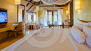 bedroom Interior of modern house with a swimming pool, modern pool villa at the beach, luxury villa