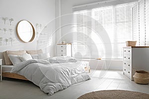 Bedroom interior with white chest of drawers