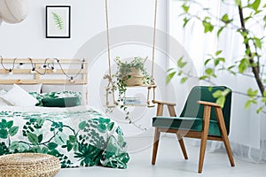 Bedroom with kale green armchair