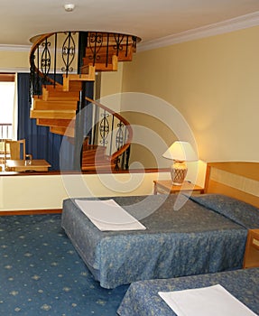 Bedroom with stairway.
