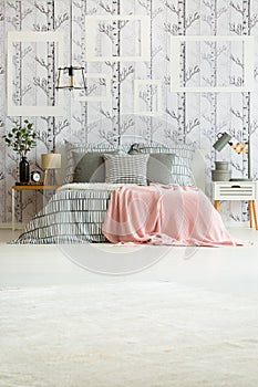 Bedroom with striped bedsheets