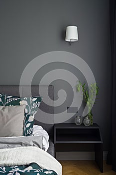 Bedroom with stylish gray wall