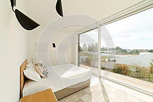 Bedroom suite in modern villa with pool and deck