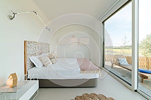 Bedroom suite in modern villa with pool and deck