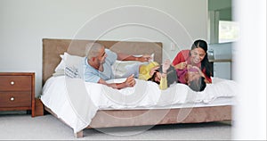 Bedroom, tickle and happy family laughing, playing games and enjoy quality time together for fun, happiness and bond