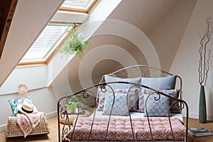 Bedroom under the eaves with natural light and seagrass floor